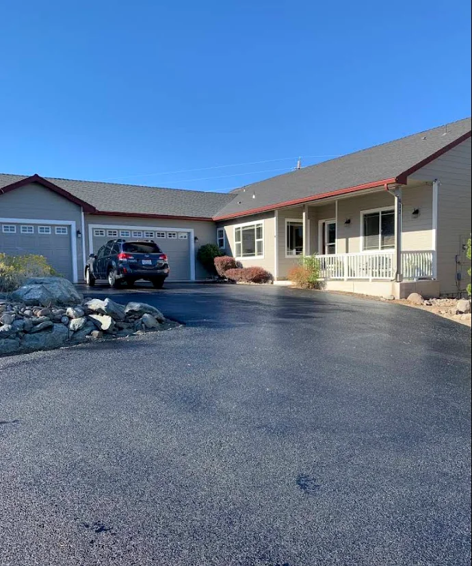 Finished asphalt driveway at a residential home
